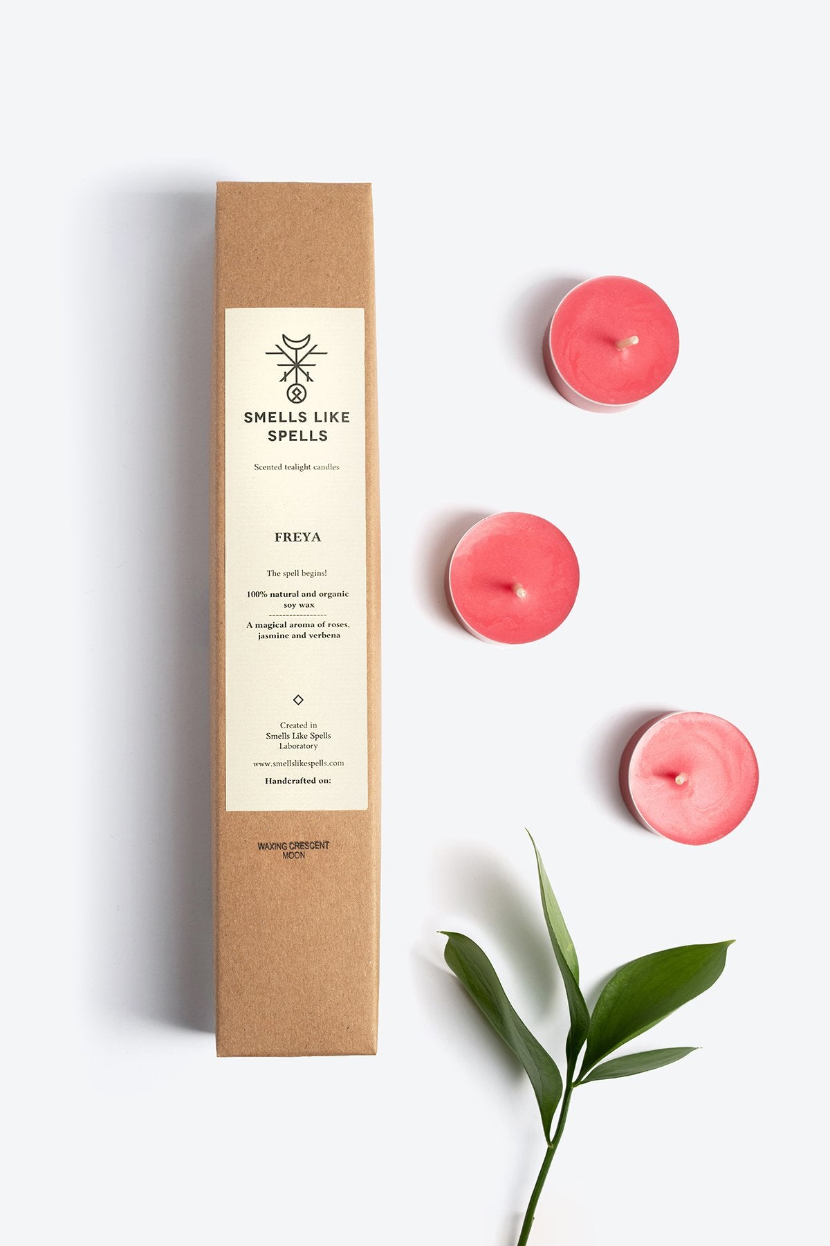 3. Smells Like Spells FREYA scented tealight candles with packaging, shown with green leaf
