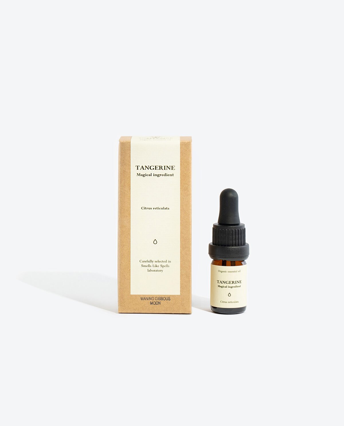 1. Smells Like Spells TANGERINE Essential Oil with box, featuring 5 ml glass bottle and pipette, studio setting