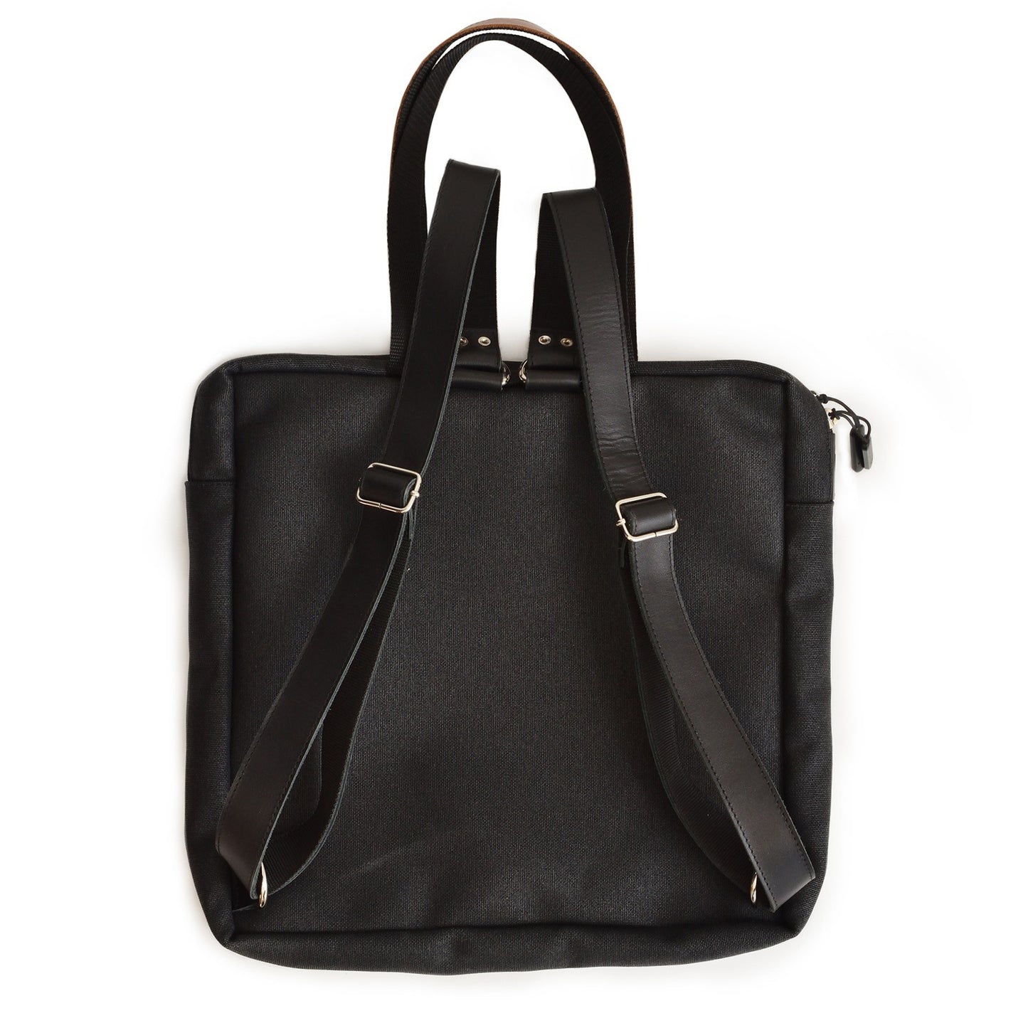 3. Studio image of the Omaking Stockholm Backpack in black, showing adjustable straps and back view