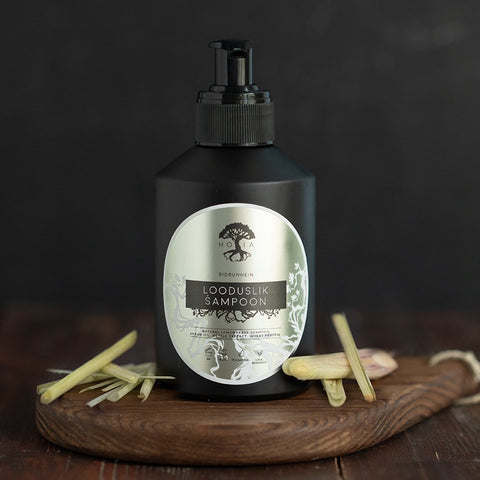1. HOIA homespa organic lemongrass shampoo in black bottle, 200ml, displayed with lemongrass on wooden board
