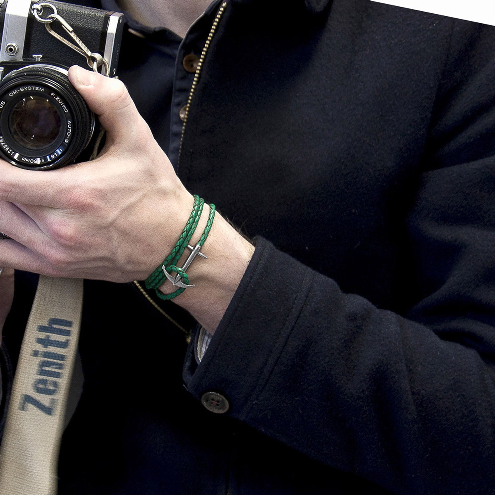 1. Men's Admiral Anchor silver and fern green braided leather bracelet by ANCHOR & CREW, worn with a camera in lifestyle setting