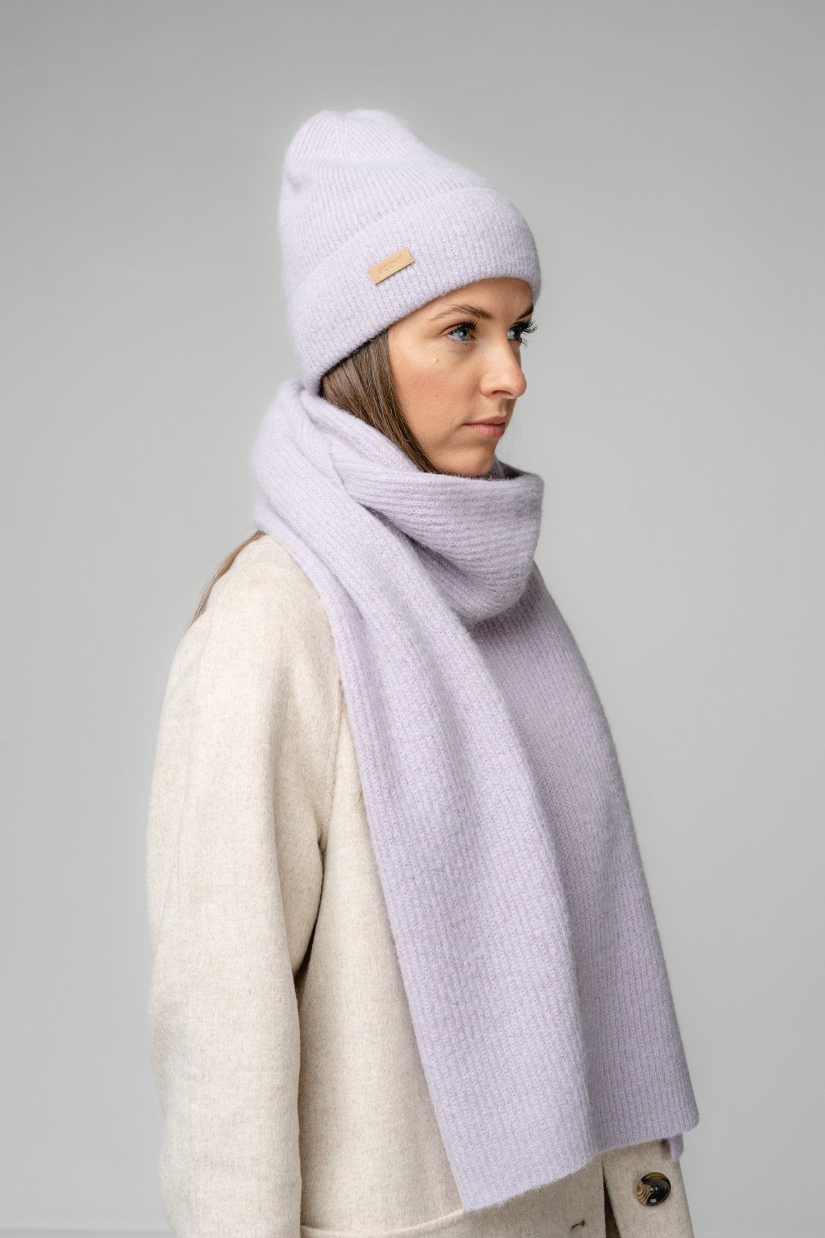 20. Women's lily Alpaka Fisherman's Rib scarf and hat set in studio setting