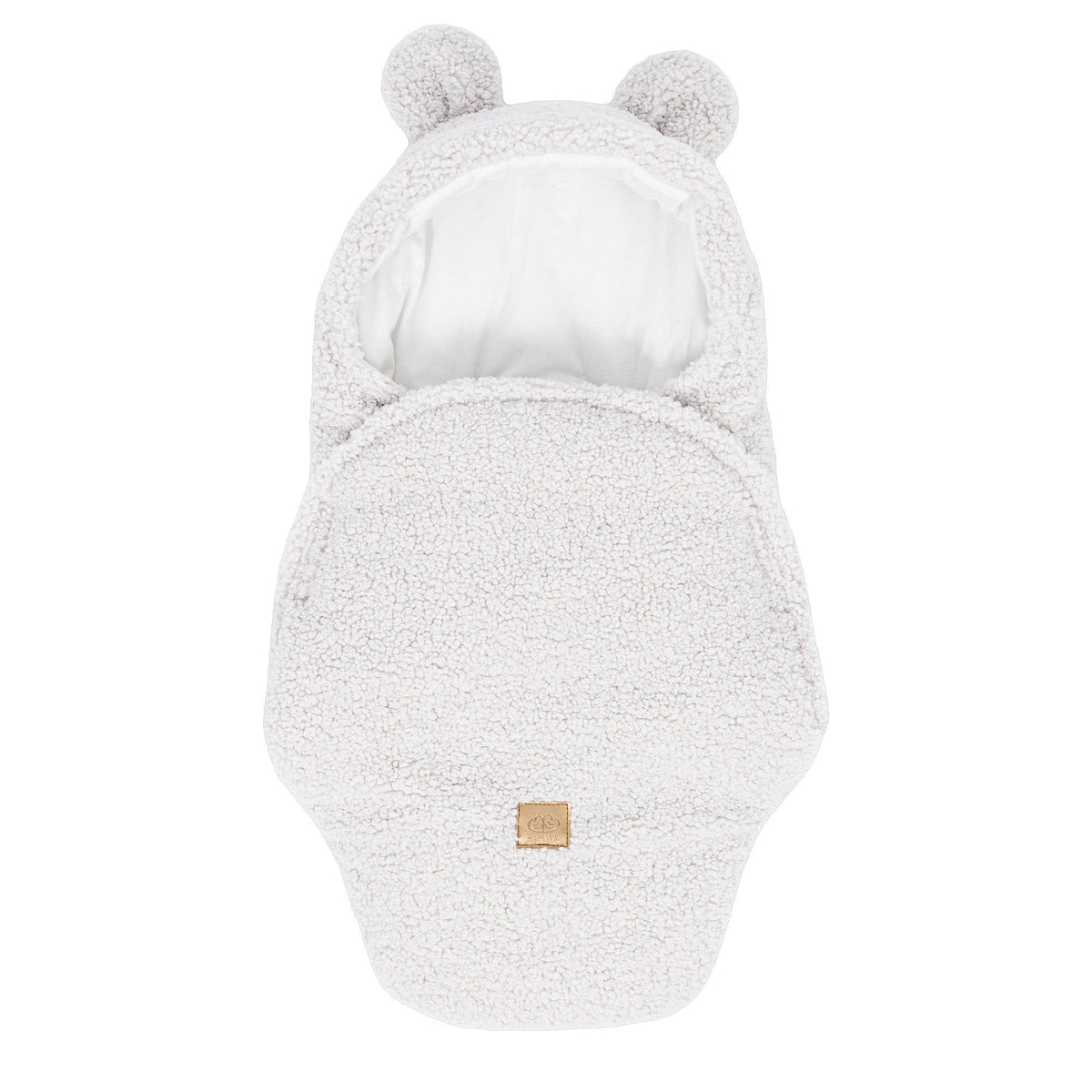 1. Off-white baby swaddle with bear ears made of boucle fabric, featuring a cotton inner layer and velcro closure, shown in a flat lay view