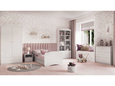 1. White children's bed in a stylish pink-themed bedroom with matching furniture and decor