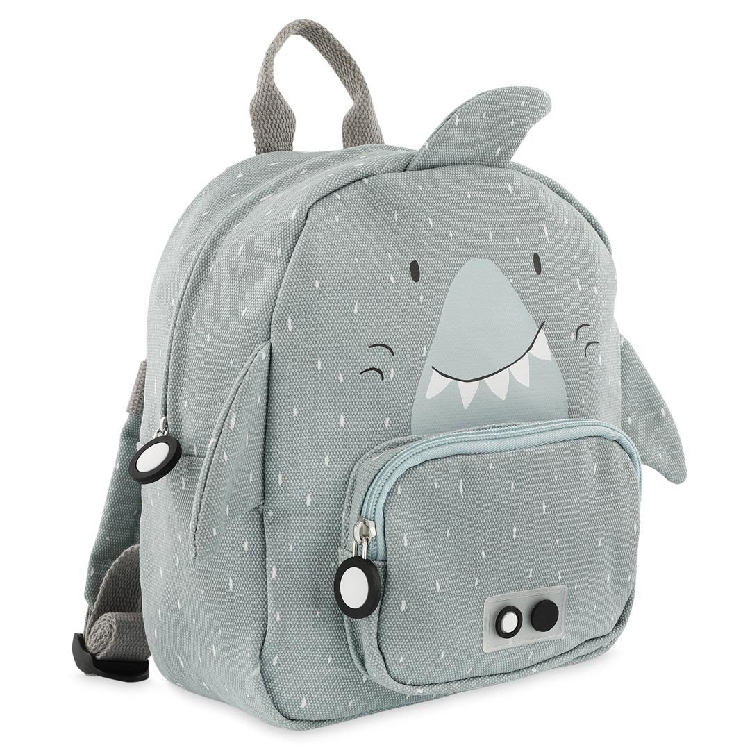 2. Side view of grey shark-themed backpack with front pocket and fin details