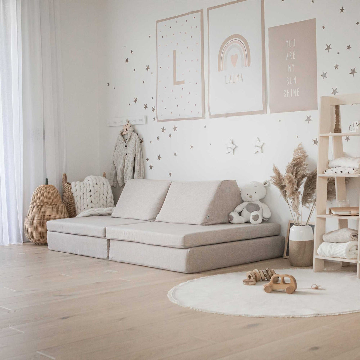 11. Beige Monboxy play mattress set arranged as a sofa in a stylish children's room