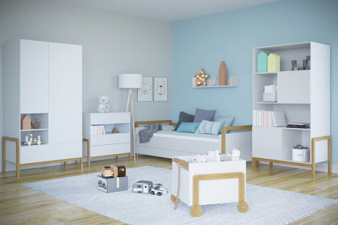 1. Kocot Kids Victor bookshelf in a modern child's room with light blue walls, paired with matching furniture and decor
