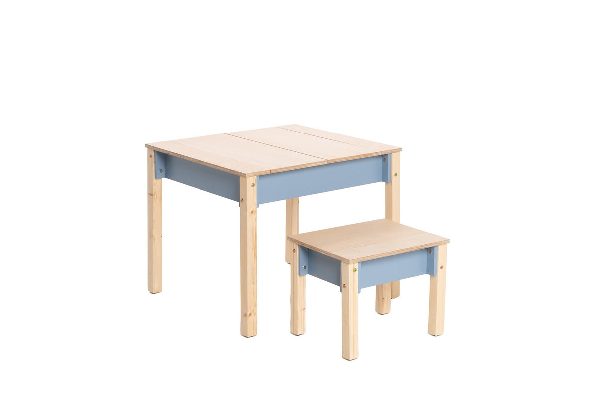 2. Studio shot of children's smart storage table and chair set in light wood and grey, closed storage compartments