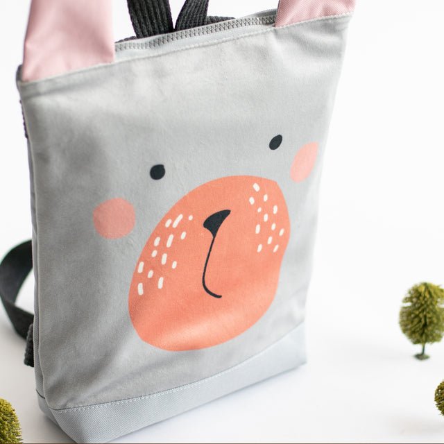 5. Side view of Muni Bunny kids backpack in studio, highlighting velvet fabric and design