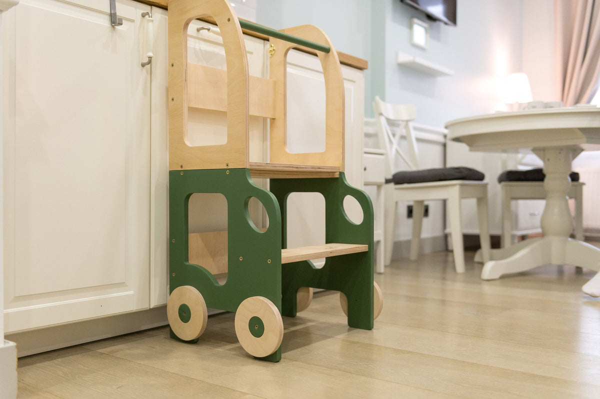 2. Green and natural wood Montessori kitchen step stool with wheel design in kitchen