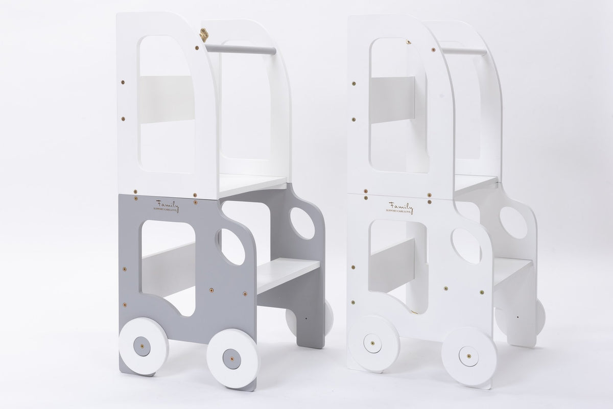 2. Two grey and white Montessori kitchen step stools with wheel design on white background