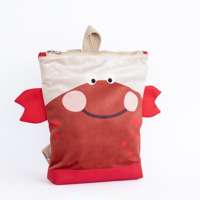 4. Studio shot of Muni kids crab backpack, angled view highlighting beige straps and zipper closure