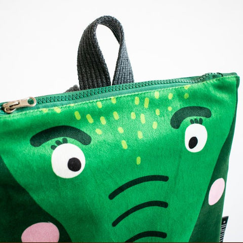 4. Close-up of Muni crocodile backpack showing green velvet fabric and zipper