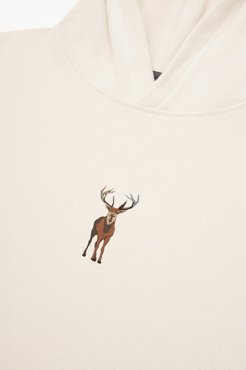 4. Close-up of embroidered deer on cream Sossu Deer Hoodie fabric