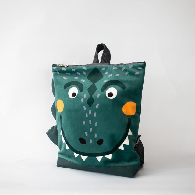 10. Studio shot of Muni dinosaur backpack showing front and side spikes