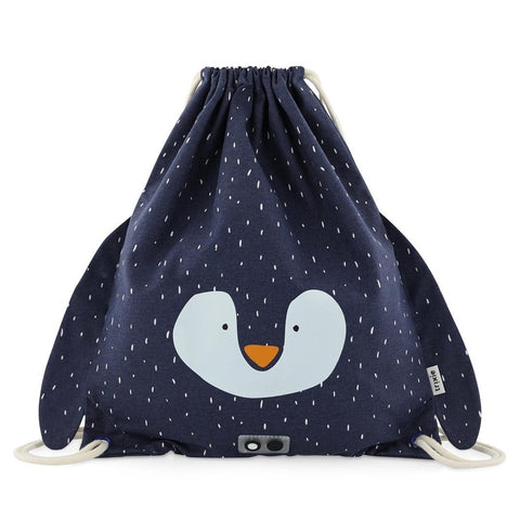 2. Studio shot of Trixie Baby's Mr. Penguin drawstring bag in navy with penguin face design and floppy ears, featuring white drawstrings and small white speckles on fabric
