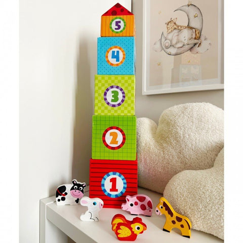 2. Stacked colorful cubes with numbers and animal figurines on a white shelf