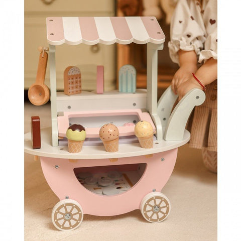 1. Wooden ice cream cart with pastel colors and magnetic scoops, shown in a playroom setting with a child nearby