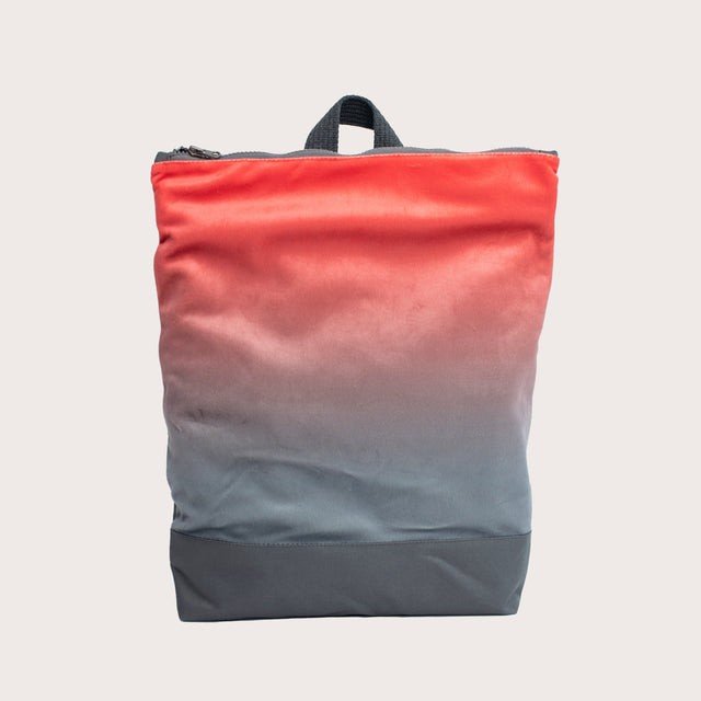 2. Muni faux leather backpack in salmon with grey bottom shown in studio with clean background