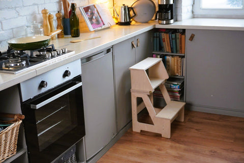 1. Wooden folding seat and climbing helper placed in kitchen corner as part of decor