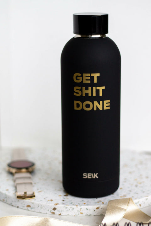 1. SEIK black steel water bottle with 'Get Shit Done' text, shown upright on a terrazzo surface
