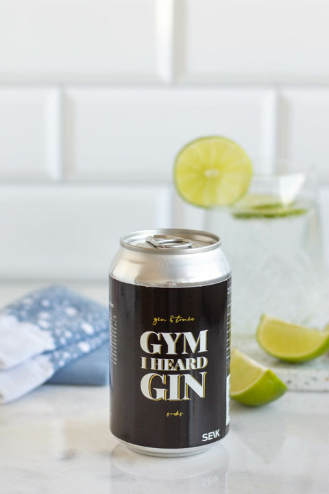 1. SEIK 'Gym I Heard Gin' socks with gin and tonic can, lifestyle setting with lime and drink