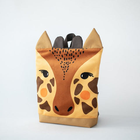 5. Muni giraffe backpack in studio, side view showing giraffe design and sturdy construction