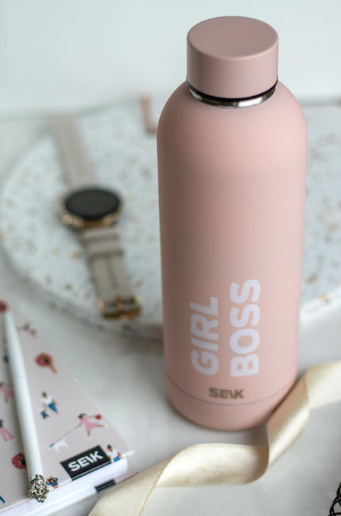 3. SEIK Girl Boss thermos in pink, displayed with a watch and notebook for a chic look