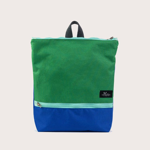 5. Angled studio view of Muni waterproof kids backpack in green and blue, highlighting design