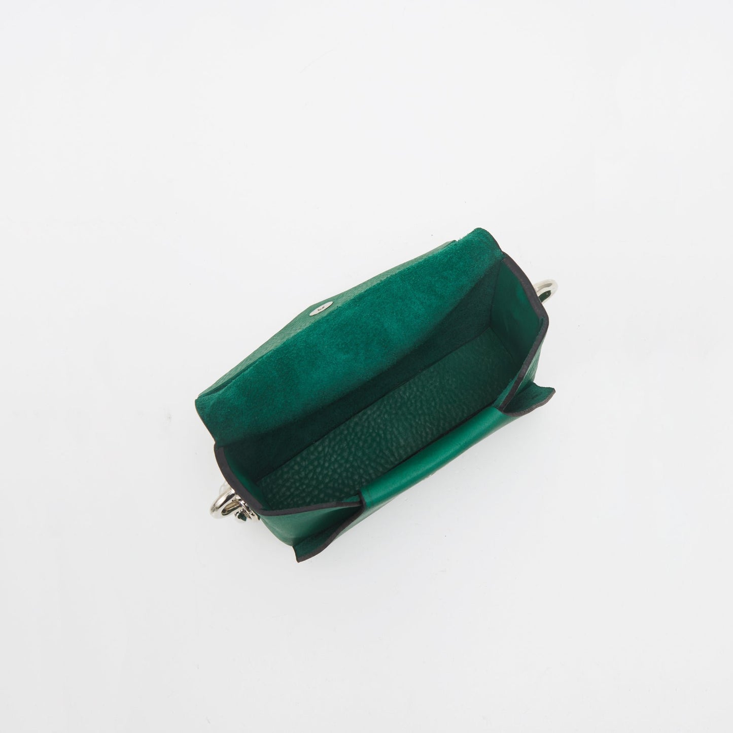 7. Interior view of Daz Studio green leather envelope bag with raw leather finish
