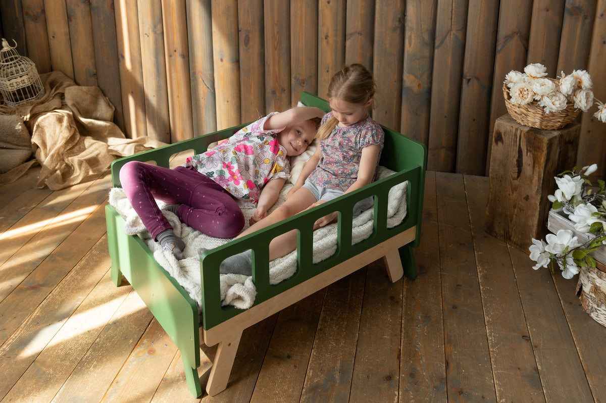 7. Two children relaxing on green growing bed in sunlit wooden room