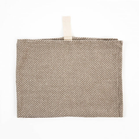 1. Beige linen towel with checkered fishbone pattern and white cotton hanger on white background