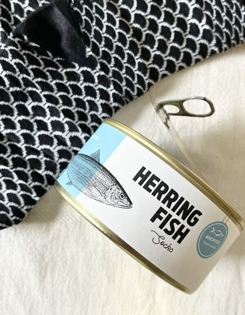 1. SEIK Herring Socks in a Can, unisex design, black and white fish scale pattern, shown with open can