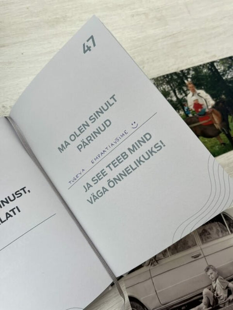 4. Detailed view of SEIK '100 ASJA, MIDA ISA JUURES ARMASTAN' book page 47, highlighting personal reflection prompts