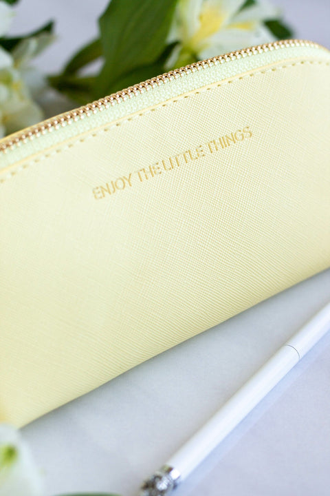 3. Close-up of SEIK Pencil Case Sunshine in yellow with 'Enjoy the little things' text, next to a white pen