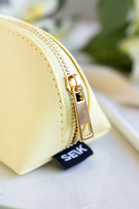 4. Close-up of SEIK Pencil Case Sunshine in yellow, highlighting gold zipper and SEIK branding