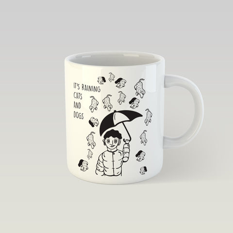 1. SEIK design mug featuring 'It's Raining Cats and Dogs' illustration by Paula Helena Kuklane, showing a person with an umbrella surrounded by cats and dogs, perfect for cozy moments, 330ml capacity