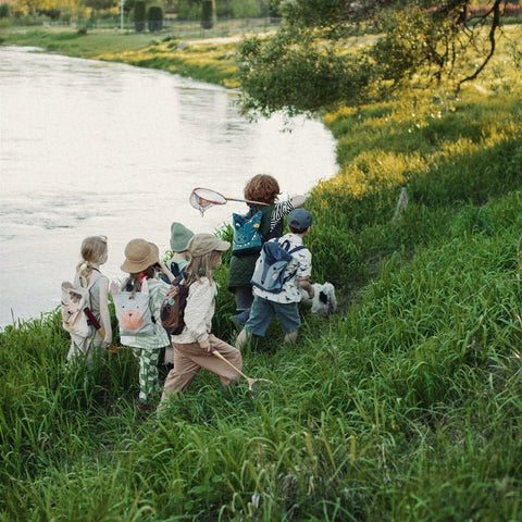 4. Group of children with Muni backpacks on a nature hike