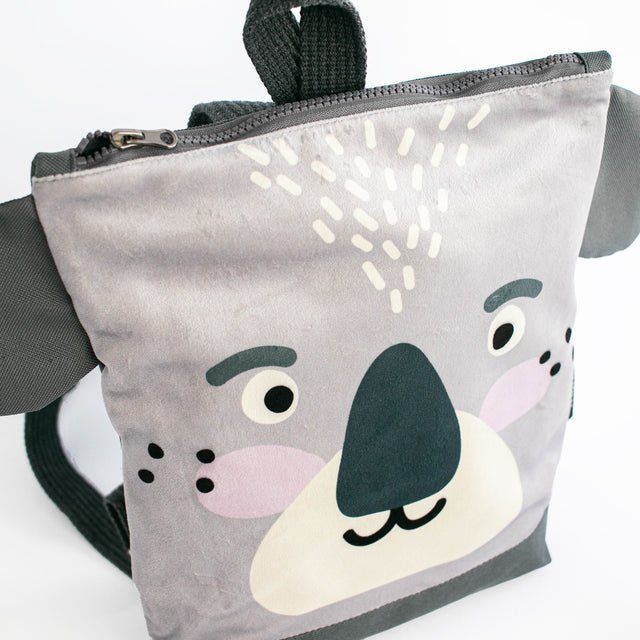 7. Close-up of Muni Koala backpack front, featuring koala face design and velvet texture