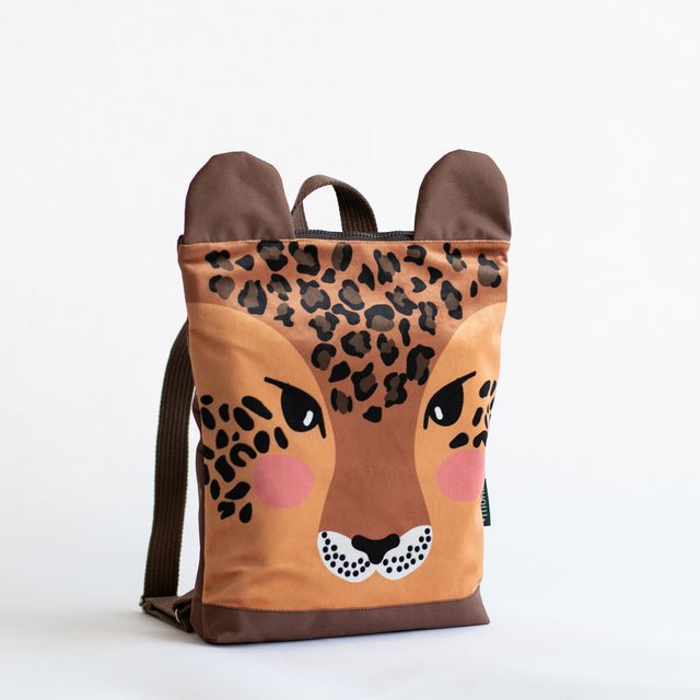 6. Muni kids leopard backpack, front view highlighting velvet fabric and design in studio