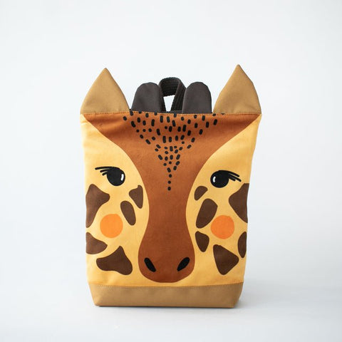 4. Muni giraffe backpack in studio, featuring giraffe face design and velvet fabric