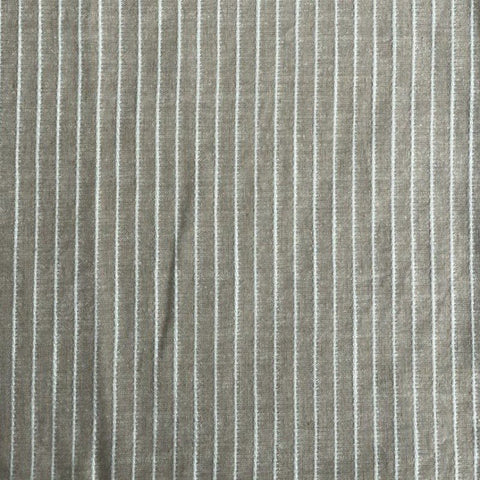 2. Close-up of linen sauna seat cover fabric with vertical light stripes, highlighting texture and mixed fibers.