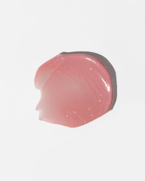 4. Close-up of LUUV Lip Gloss Balm in Sweet, showing shimmering soft pink texture