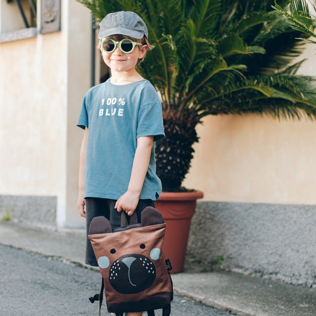 3. Muni kids bear backpack in studio, front view showing bear face design