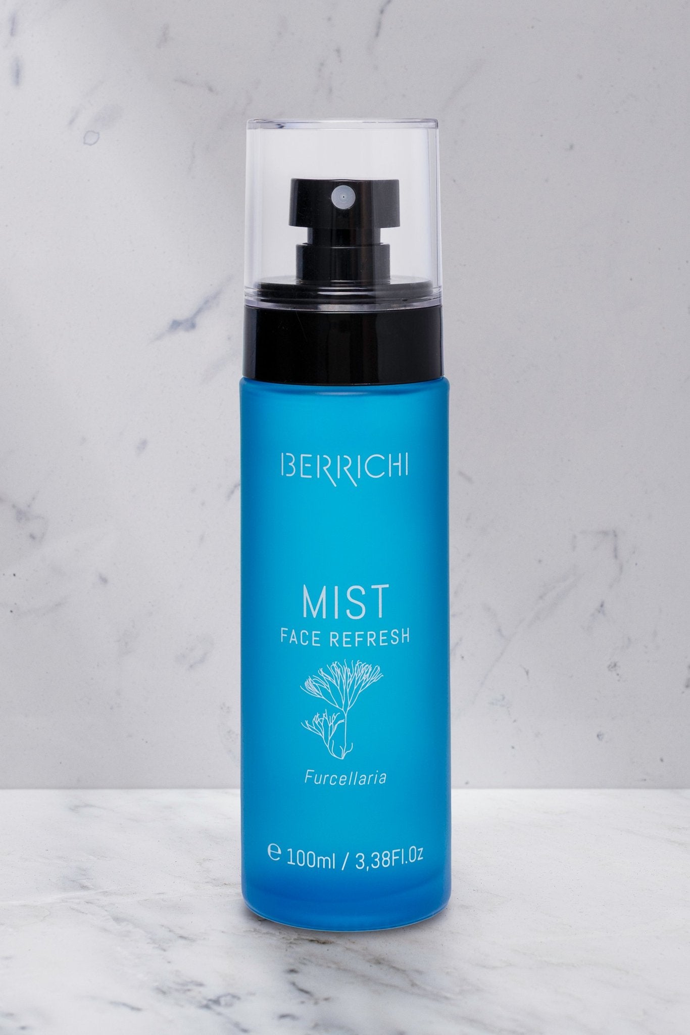 6. Berrichi MIST Face Spray bottle on marble surface, showcasing sleek design