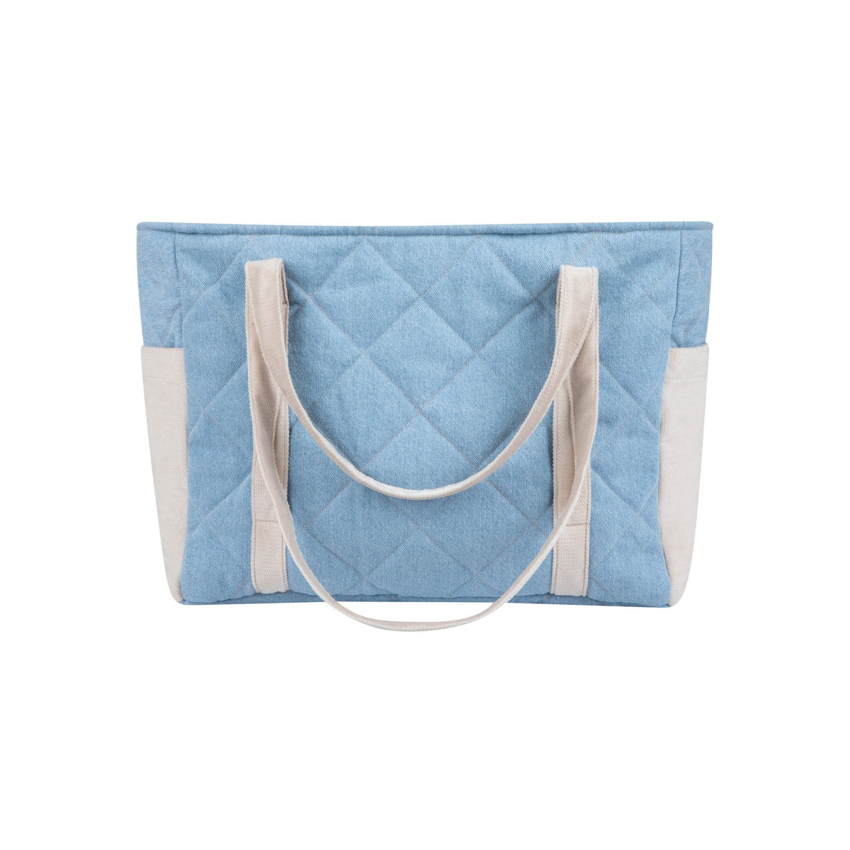 7. Back view of blue quilted weekender bag with beige handles and outer pockets in a studio setting