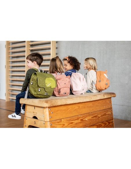 1. Group of children with various colored Trixie Baby school bags, including green Mr Dino