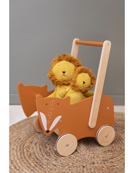 1. Wooden cart with Mr. Fox design holding two plush lion toys on a woven rug