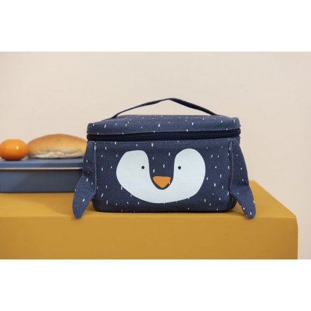 1. Child's thermal lunch bag with penguin design on table with food, showcasing playful style
