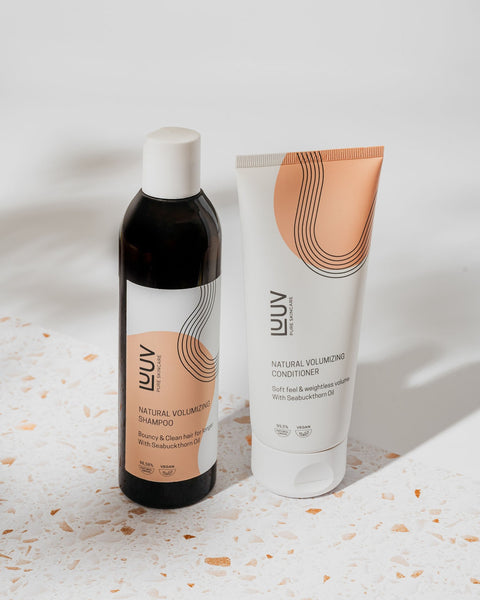 1. LUUV Natural Sea Buckthorn Shampoo and Conditioner Set displayed on a terrazzo surface, showcasing eco-friendly packaging